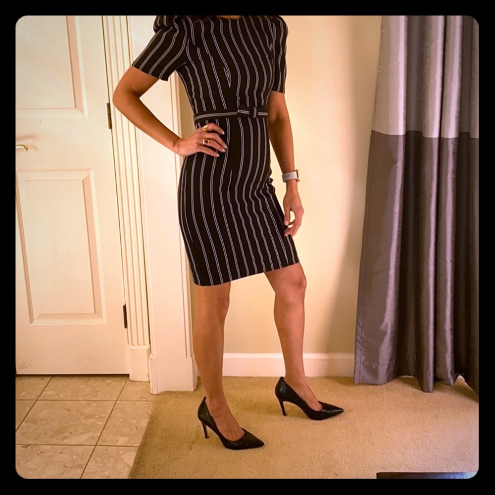 Black striped dress with cuff sleeves.